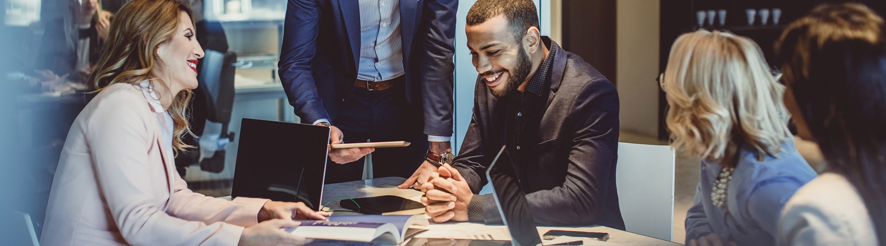 People reviewing document in meeting